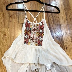 Super cute flowy top with cutout back